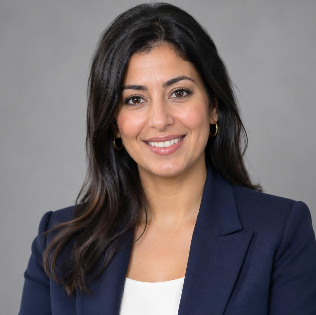 Portrait of a smiling woman with dark hair in a business jacket